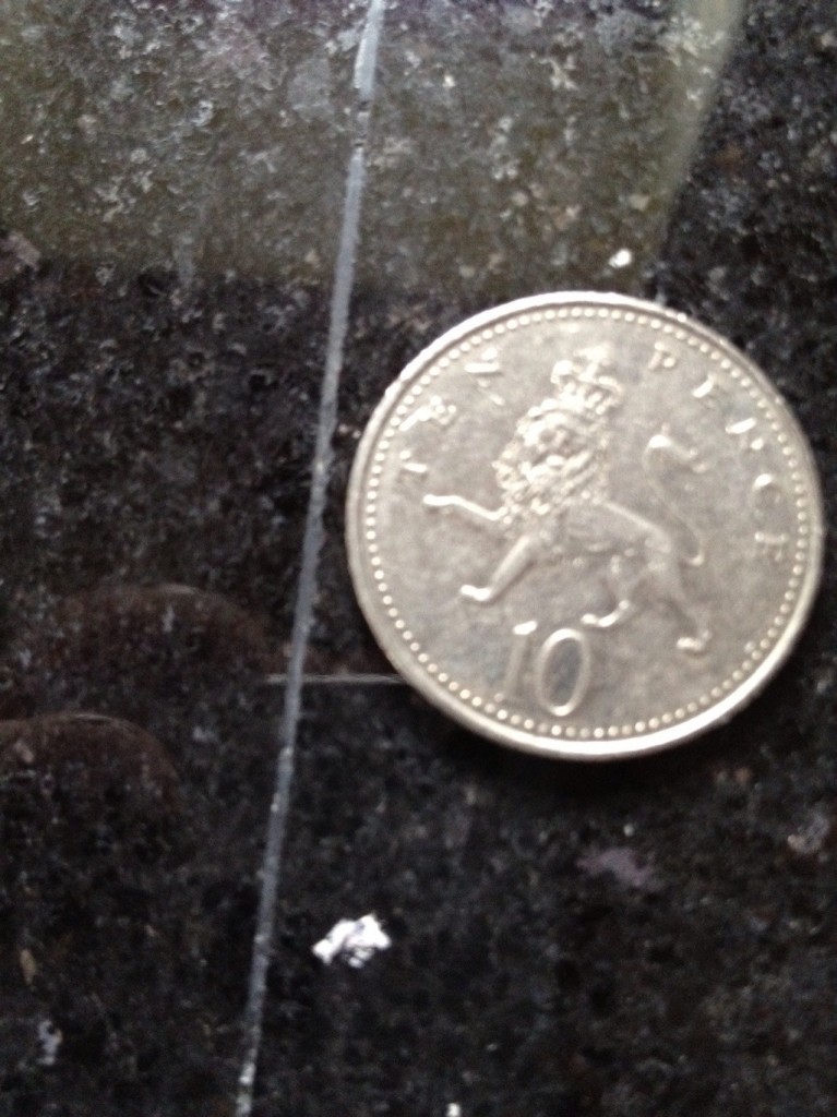 10 Pence Piece on Granite Worktop